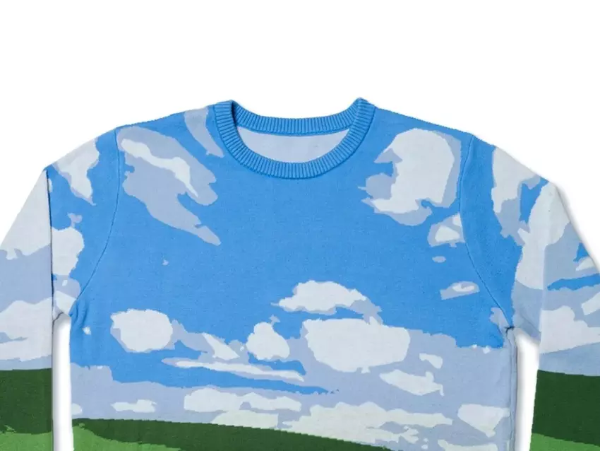 Microsoft heeft een lelijke kersttrui uitgebracht in de stijl van de beroemde achtergrond van Windows XP