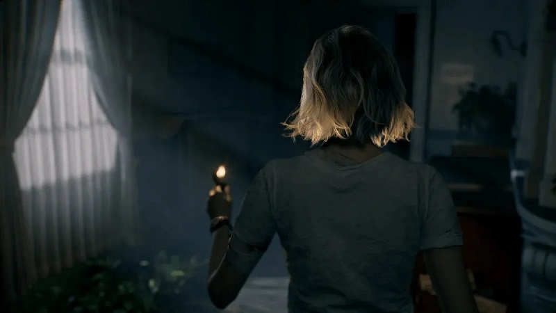 Een still uit Resident Evil 9: Grace met een aansteker Een still uit Resident Evil 9: Grace met een aansteker